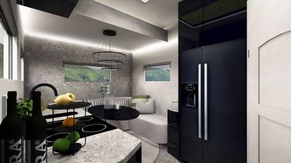 Погледнат отвън този сив и дори заплашителен автомобил не изглежда ни най-малко луксозен, но при влизане се открива напълно различен свят, където бяло, черно и сиво се смесват, за да създадат нещо повече от елегантен малък апартамент.